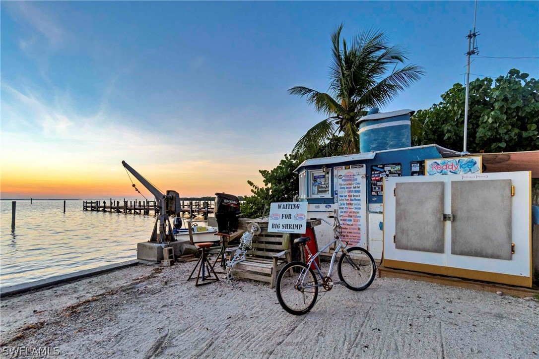 15107 Captiva Drive Captiva, FL 33924 - Photo 22 of 35 a view of a deck with chairs in front of a house