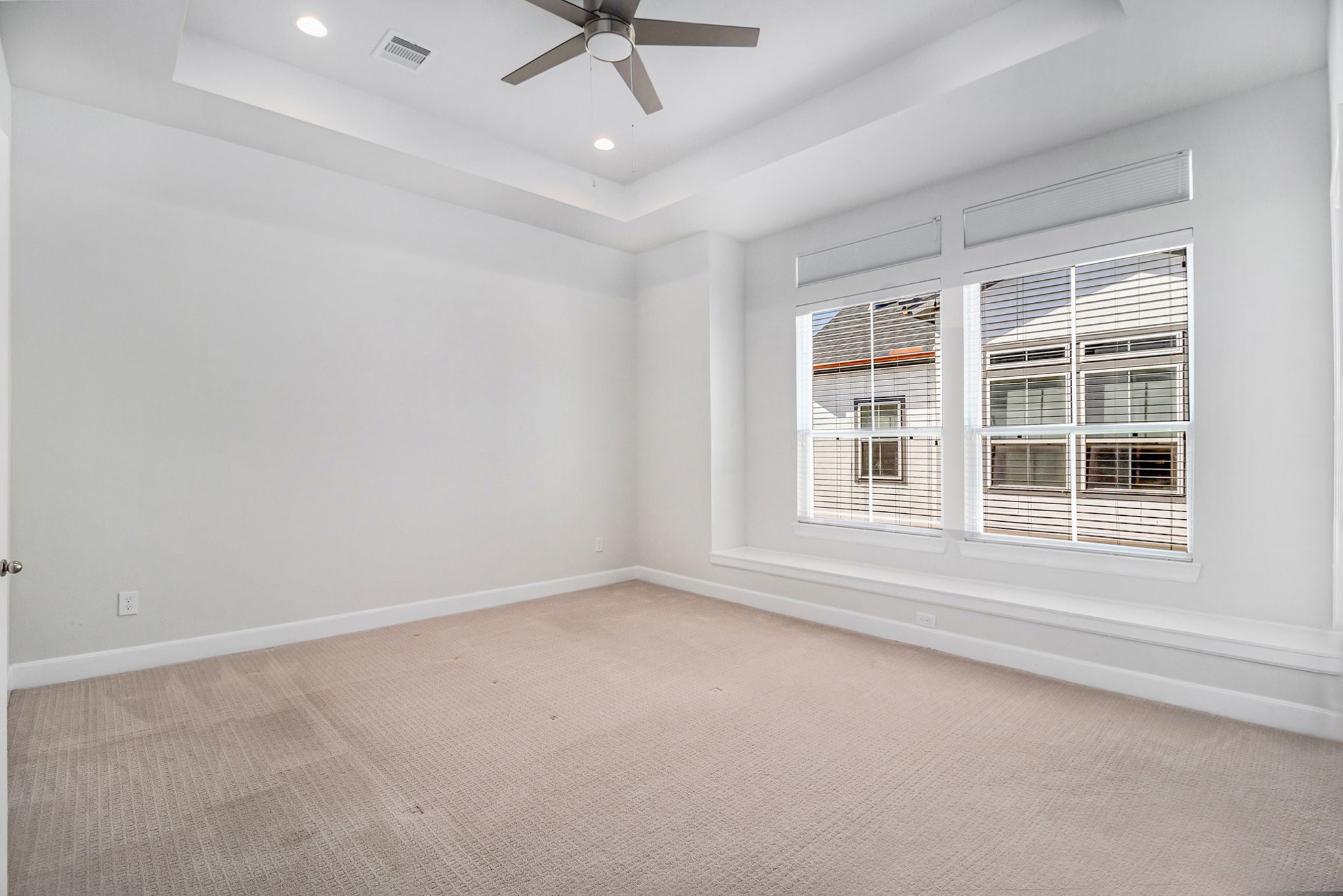 9573 Neuens Road, Unit A Houston, TX 77080 - Photo 12 of 22 an empty room with a window and ceiling fan
