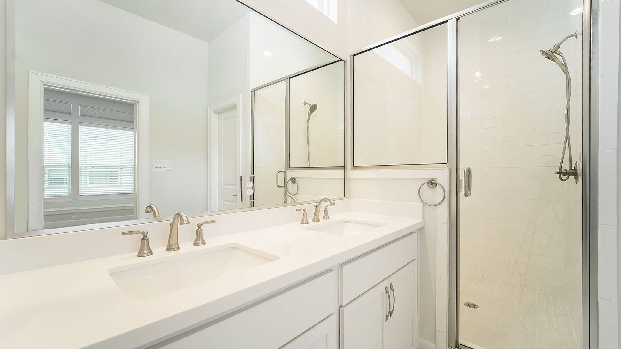 9573 Neuens Road, Unit A Houston, TX 77080 - Photo 15 of 22 a bathroom with a sink and a large mirror