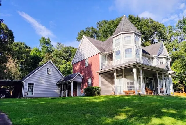 front view of a house with a yard