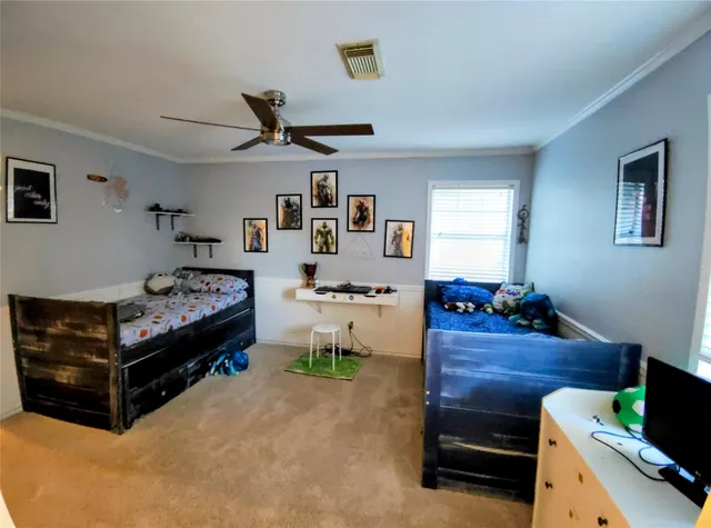 a bedroom with furniture and a window