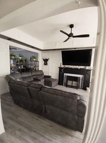 a living room with furniture and a fireplace