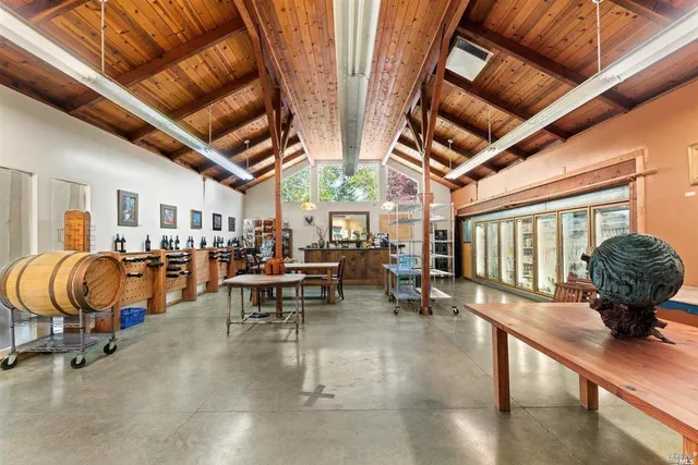 a lobby with furniture and floor to ceiling window