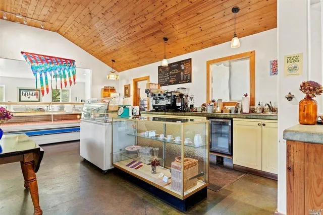 a room with wooden floor and furniture