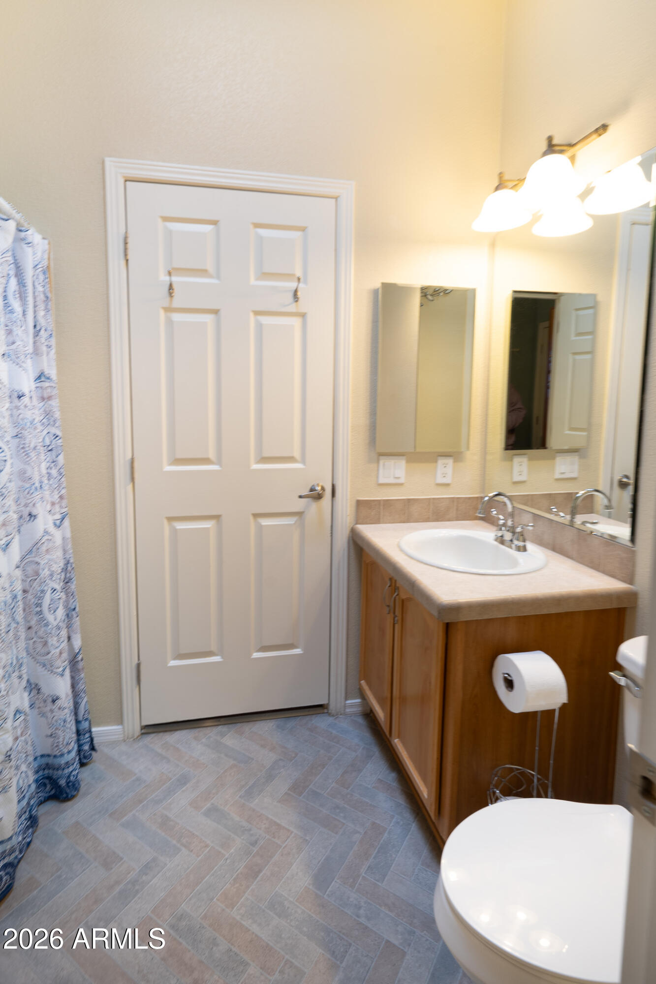 17844 North 17th Place Phoenix, AZ 85022 - Photo 14 of 22 a bathroom with a sink and a mirror