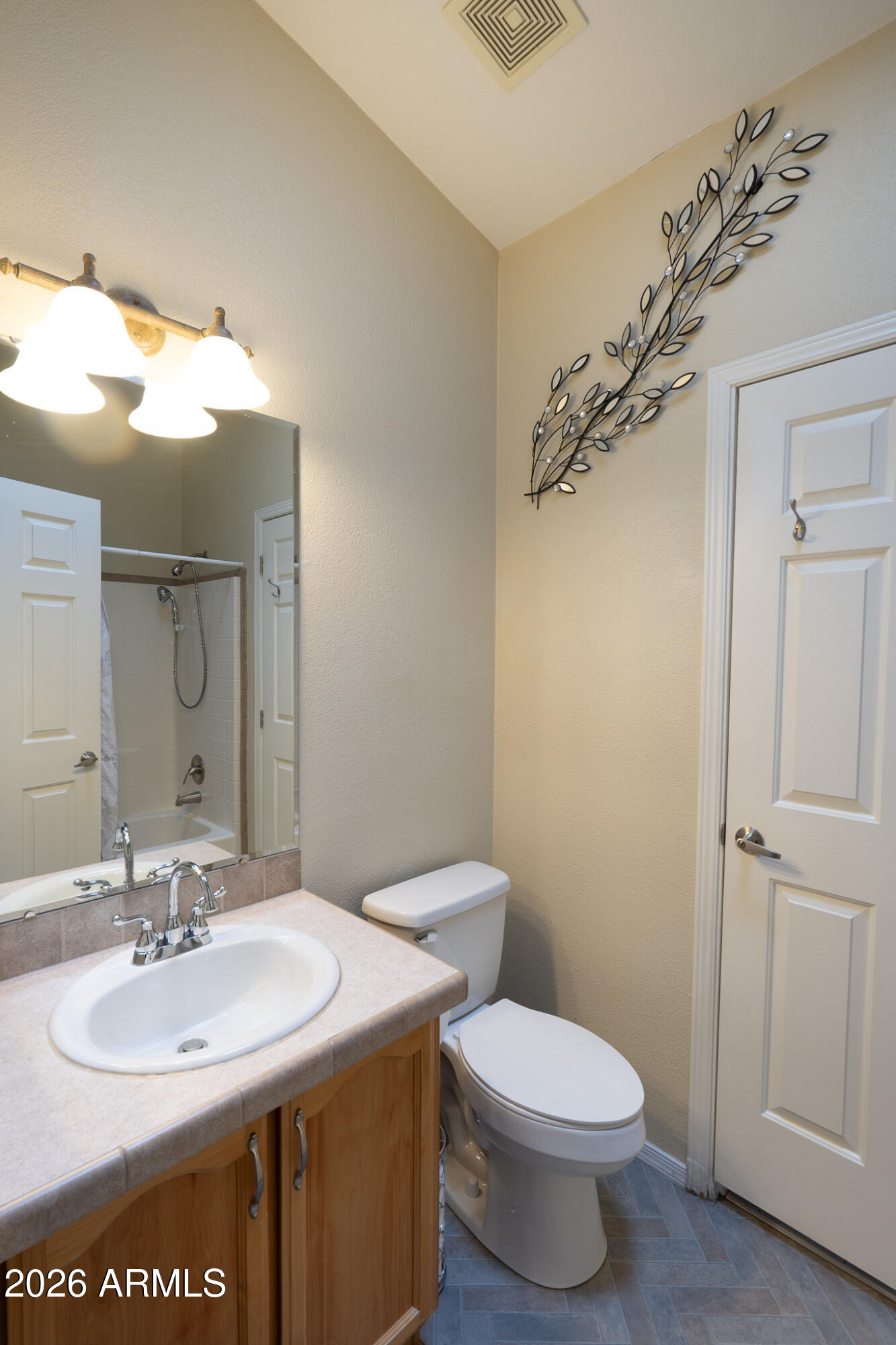 17844 North 17th Place Phoenix, AZ 85022 - Photo 15 of 22 a bathroom with a sink a toilet and mirror