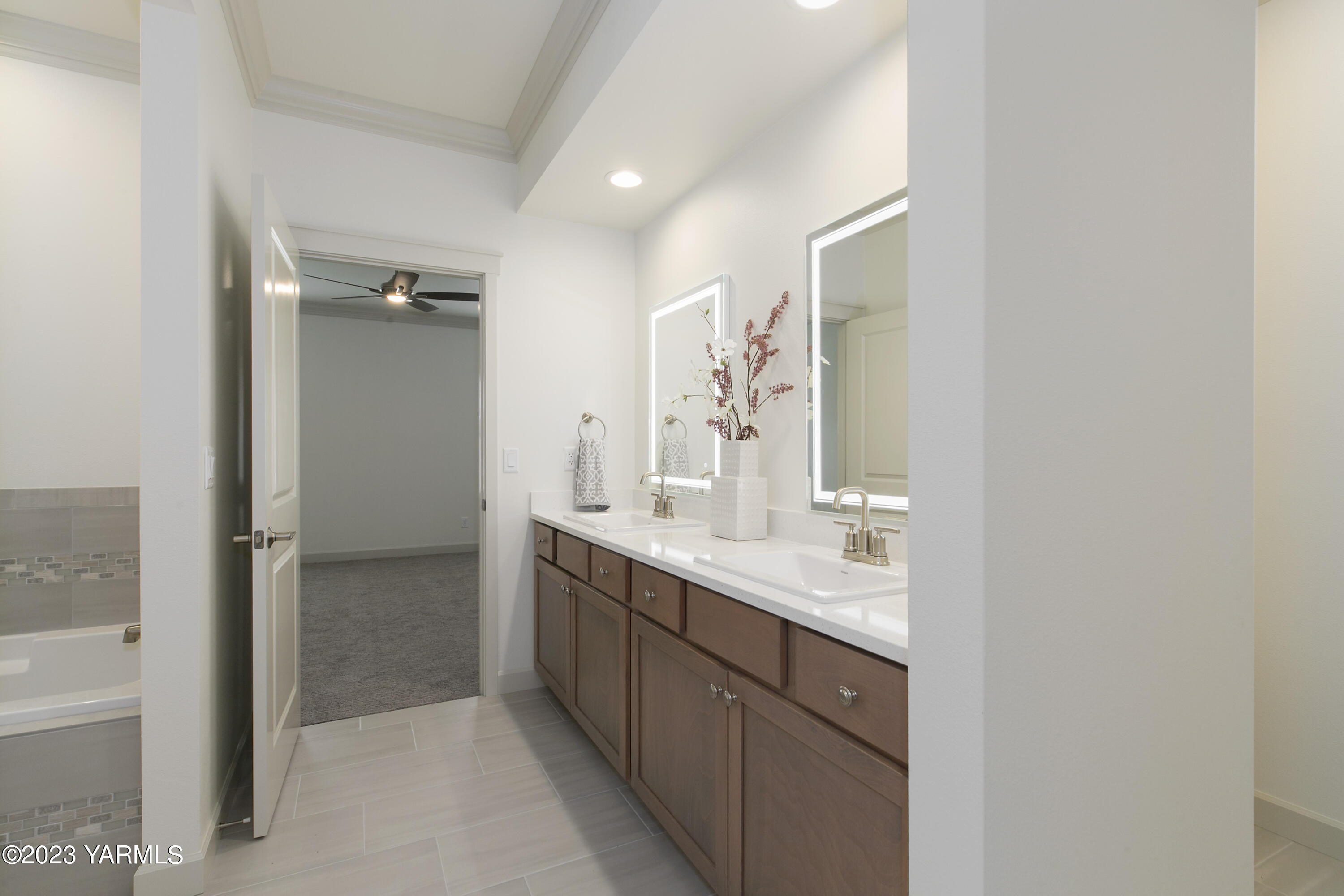 7201 Vista Ridge Avenue Yakima, WA 98903 - Photo 16 of 25 a bathroom with a double vanity sink and mirror