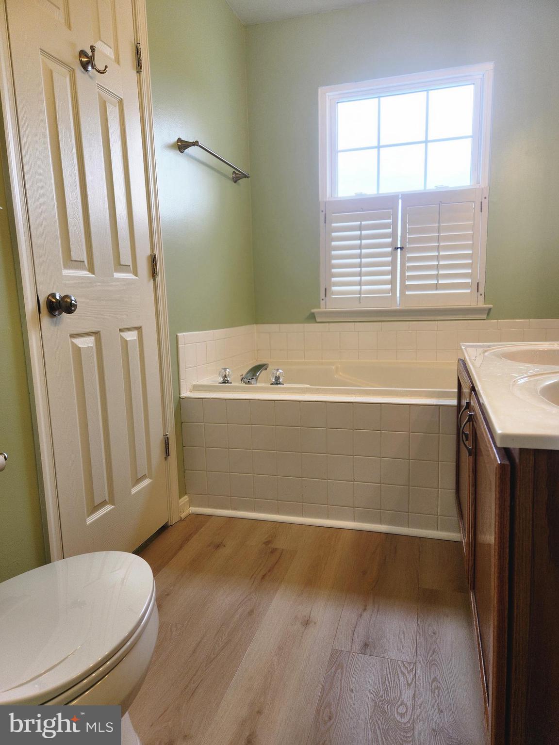 4764 Benecia Lane Dumfries, VA 22025 - Photo 14 of 17 a bathroom with a tub a sink and a toilet