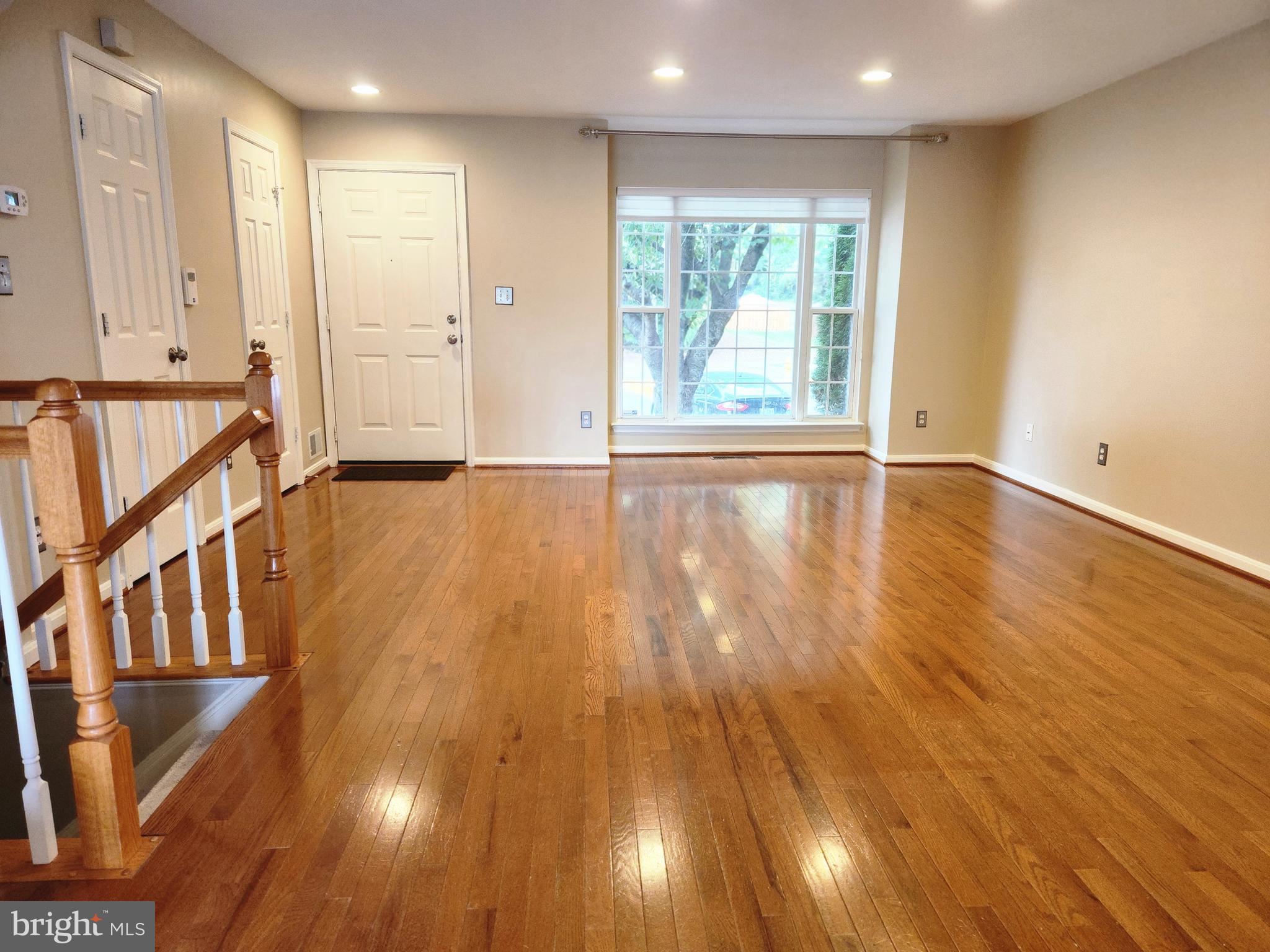 4764 Benecia Lane Dumfries, VA 22025 - Photo 4 of 17 a view of an empty room with wooden floor and a window