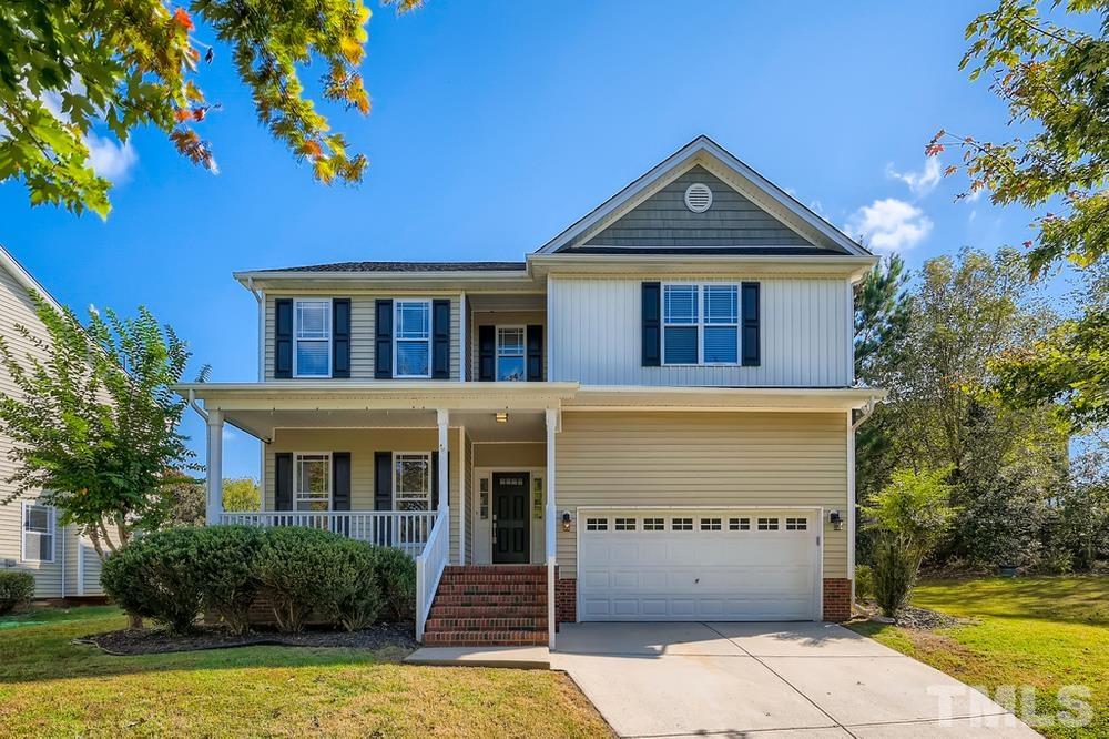 109 Oakbeech Court Holly Springs, NC 27540 - Photo 1 of 28 a front view of a house with a yard