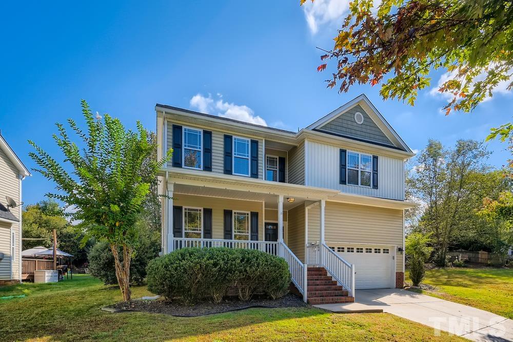 109 Oakbeech Court Holly Springs, NC 27540 - Photo 2 of 28 a front view of a house with swimming pool