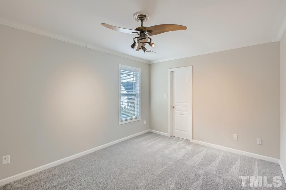 109 Oakbeech Court Holly Springs, NC 27540 - Photo 16 of 28 a view of an empty room with a window