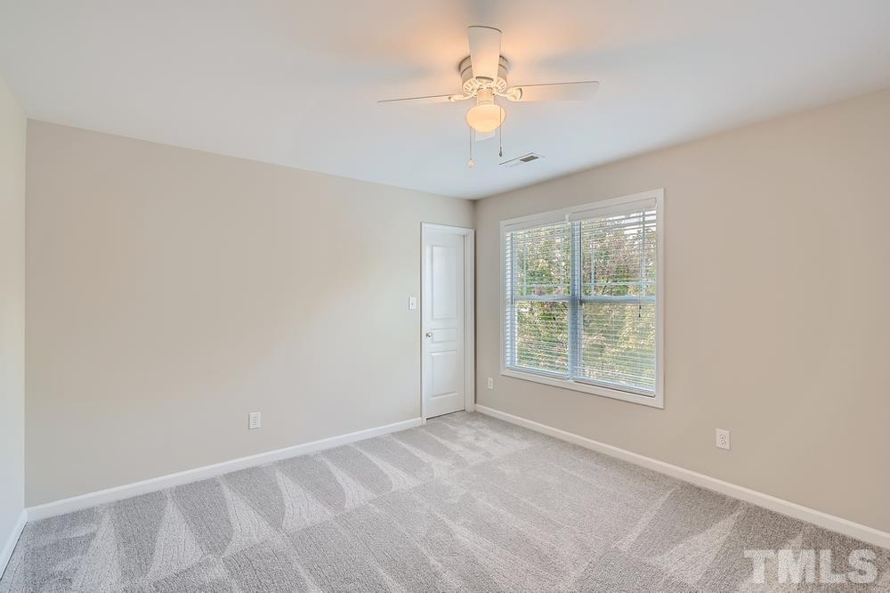 109 Oakbeech Court Holly Springs, NC 27540 - Photo 17 of 28 an empty room with a window