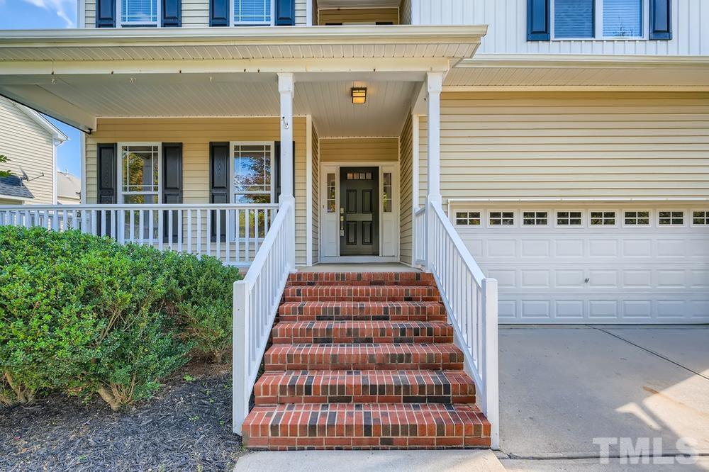 109 Oakbeech Court Holly Springs, NC 27540 - Photo 3 of 28 a front view of a house with a porch