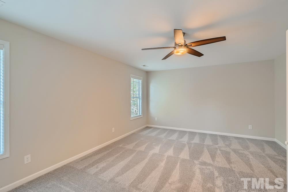 109 Oakbeech Court Holly Springs, NC 27540 - Photo 21 of 28 wooden floor in an empty room with a window