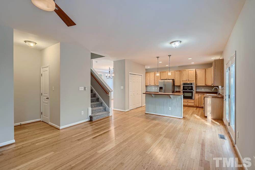 109 Oakbeech Court Holly Springs, NC 27540 - Photo 6 of 28 a view of kitchen with refrigerator microwave and stove