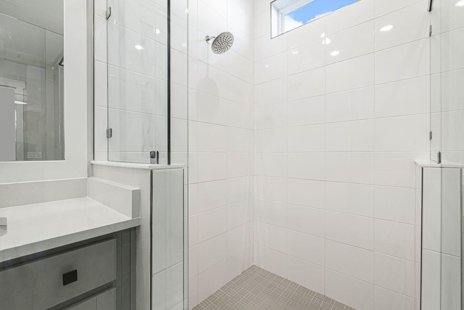 94 Ravine Road Watersound, FL 32461 - Photo 25 of 35 a bathroom with a sink and a mirror
