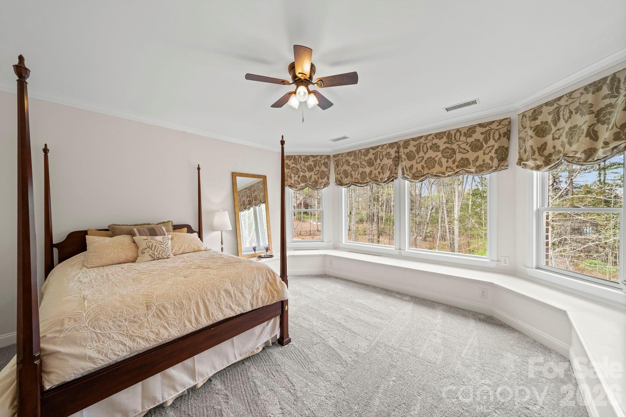 1802 Summit View Place Waxhaw, NC 28173 - Photo 34 of 47 a bedroom with a large bed and a large window