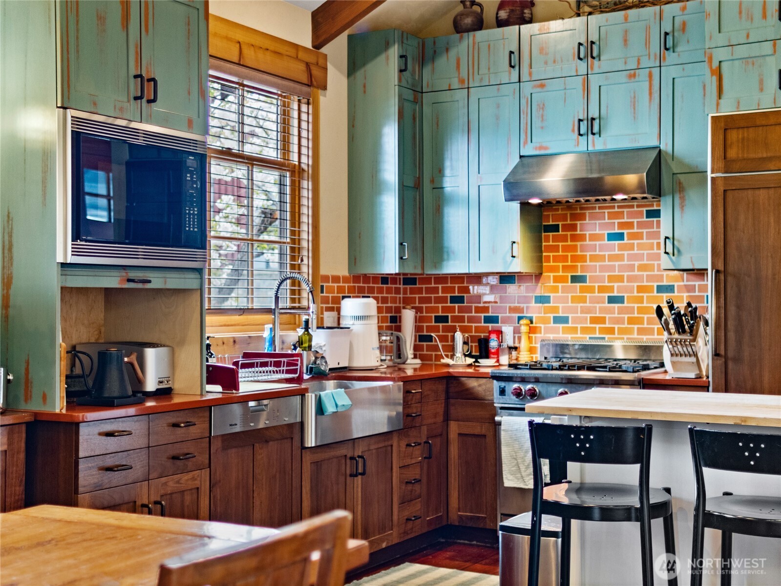 5814 Colockum Road Malaga, WA 98828 - Photo 16 of 40 a kitchen with a sink cabinets and window