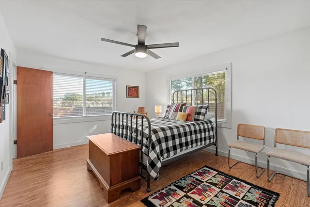 a bed room with furniture and a window