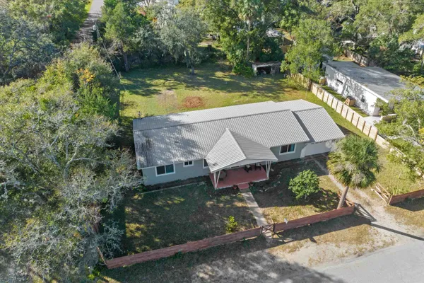 an aerial view of a house having swimming pool