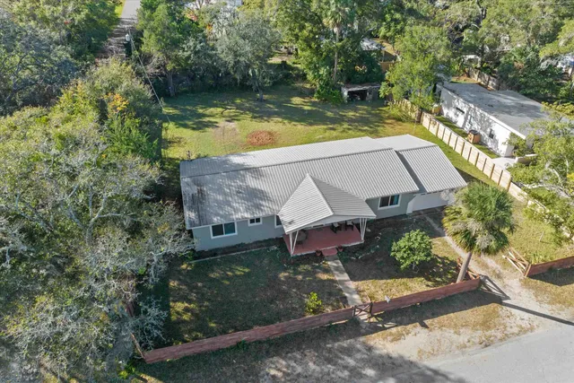an aerial view of a house having swimming pool
