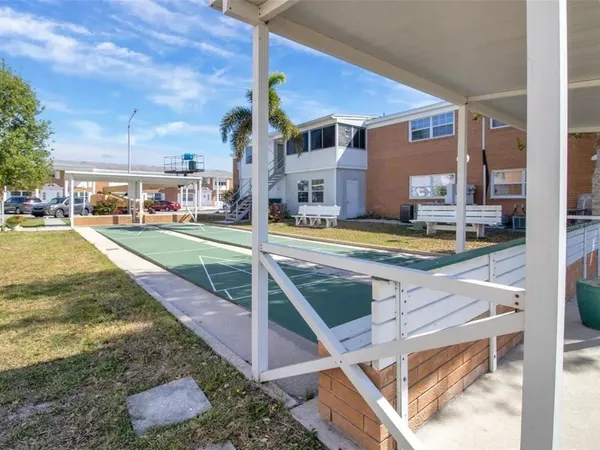 a view of swimming pool with a yard