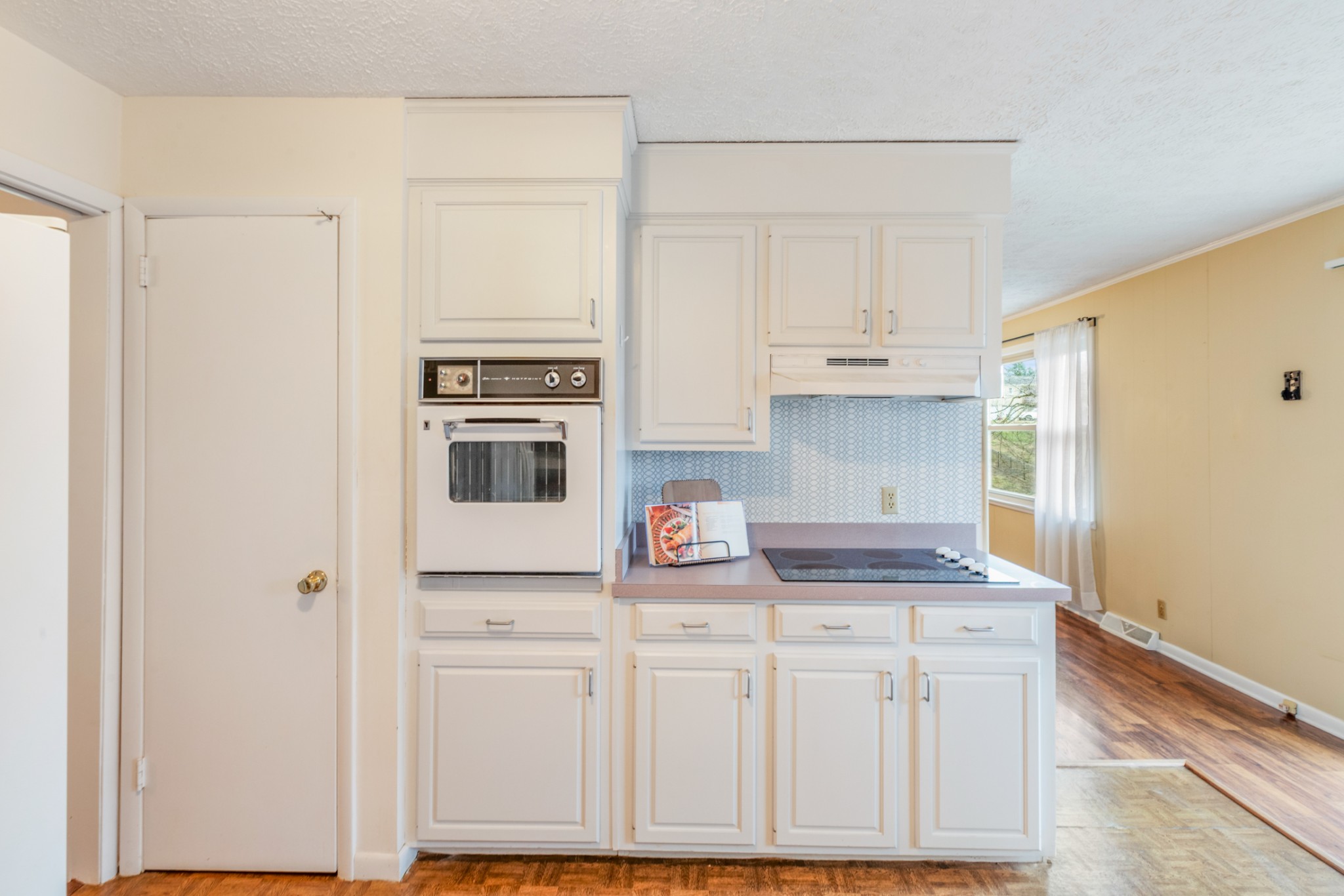 2054 Ridgecrest Circle Dickson, TN 37055 - Photo 16 of 38 a kitchen with white cabinets and white appliances