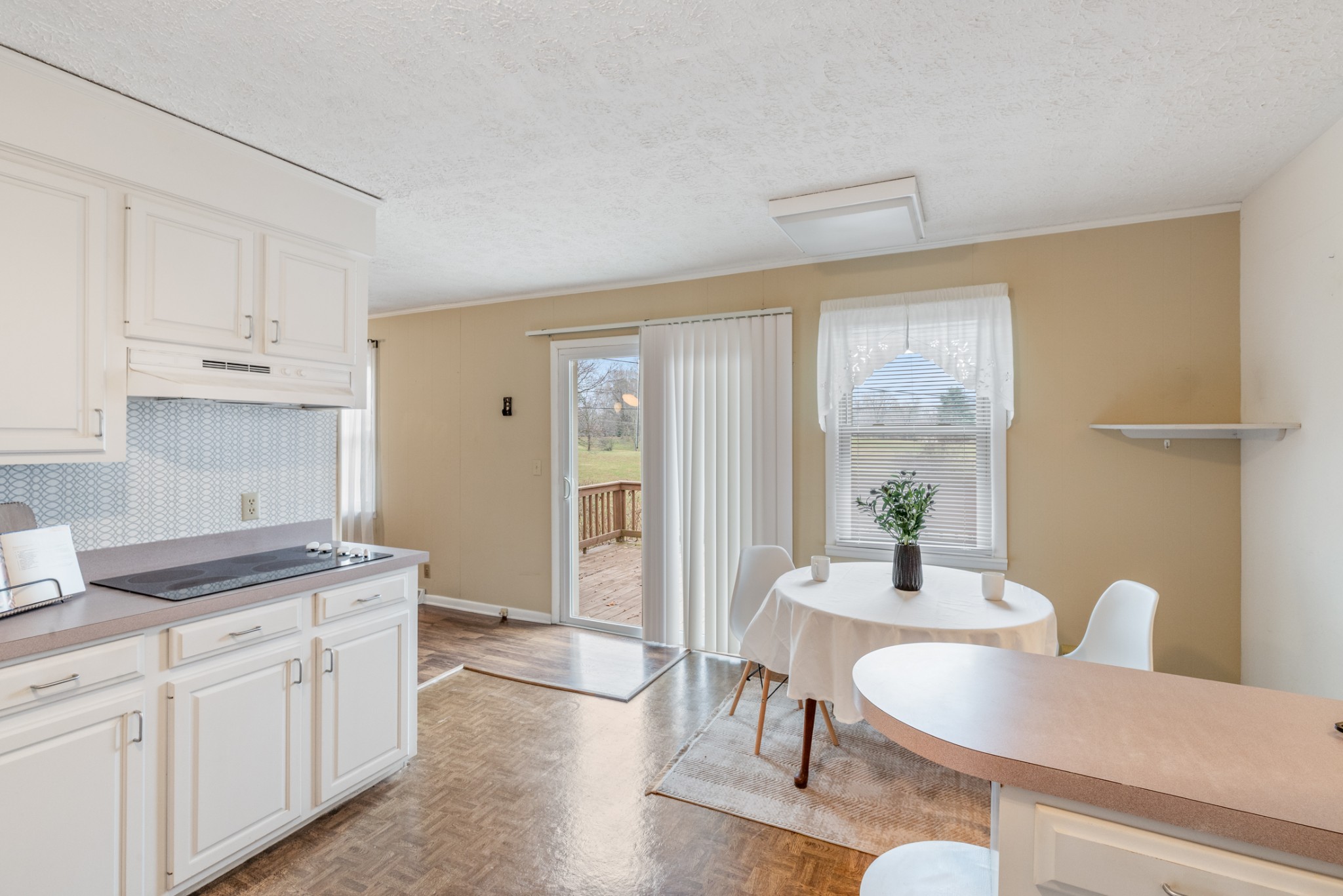 2054 Ridgecrest Circle Dickson, TN 37055 - Photo 18 of 38 a kitchen with a table chairs and granite counter tops