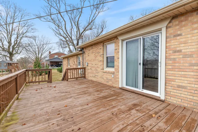 a front view of house with yard and trees