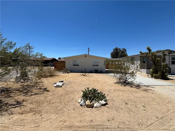 a view of a backyard of a house