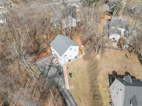 an aerial view of residential houses with outdoor space