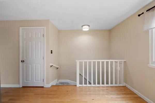 a view of a bathroom with wooden floor