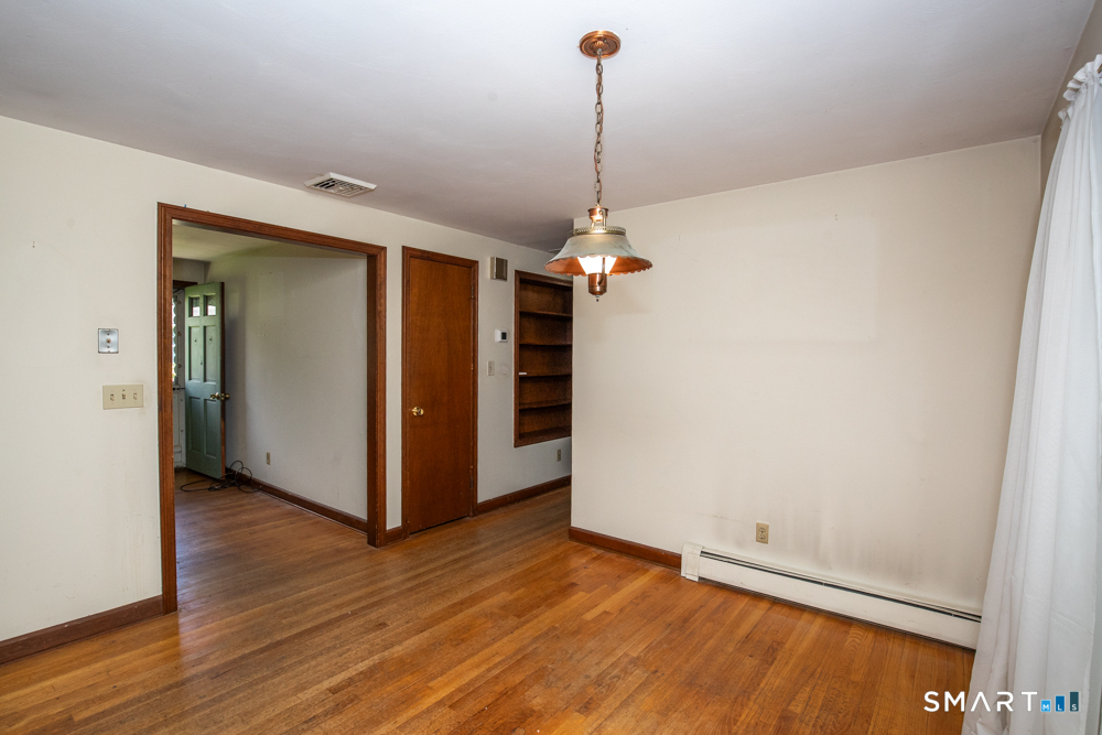 64 Somer Drive Meriden, CT 06451 - Photo 10 of 28 a view of a room with wooden floor and carpet