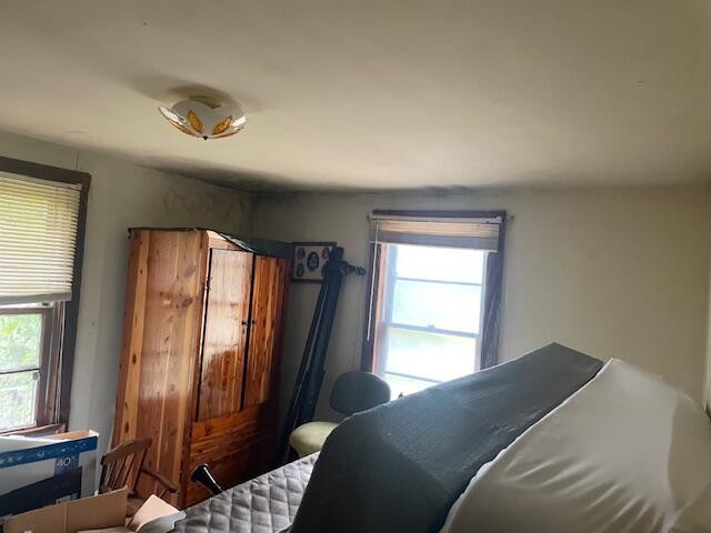 704 Annadel Road Lancing, TN 37770 - Photo 39 of 51 a bedroom with a bed and a window