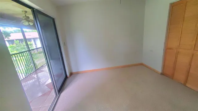 a view of an empty room and a window