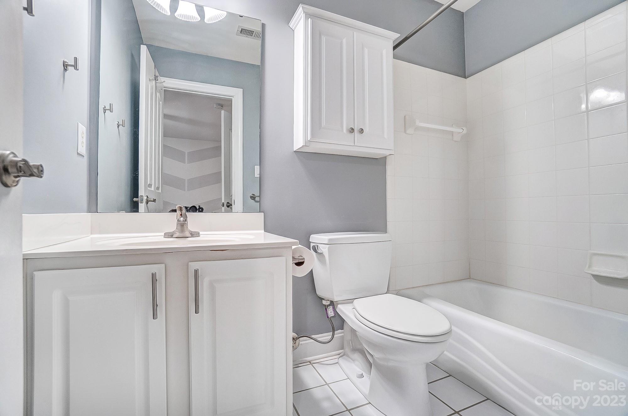 9710 Shadowmere Lane Weddington, NC 28104 - Photo 32 of 46 a bathroom with a sink a toilet and shower