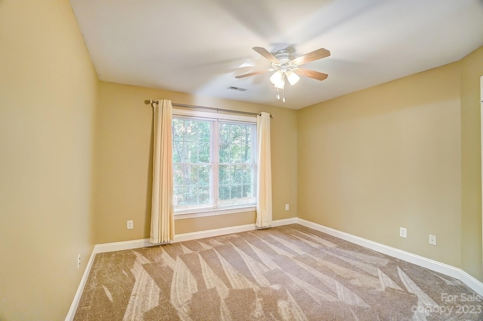 9710 Shadowmere Lane Weddington, NC 28104 - Photo 35 of 46 a view of an empty room with a window