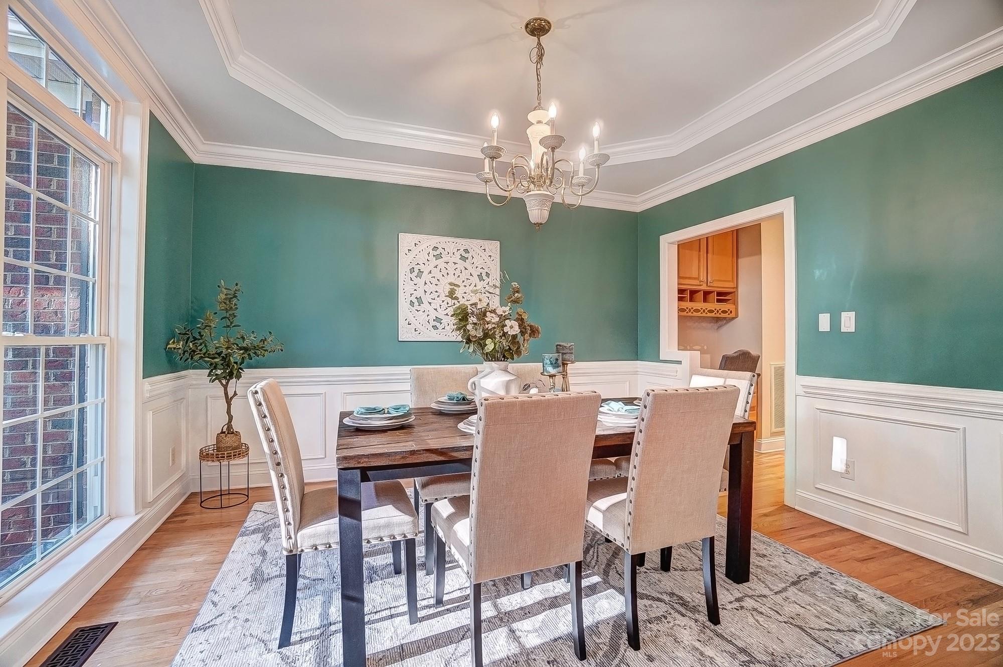 9710 Shadowmere Lane Weddington, NC 28104 - Photo 7 of 46 a view of a dining room with furniture window and wooden floor