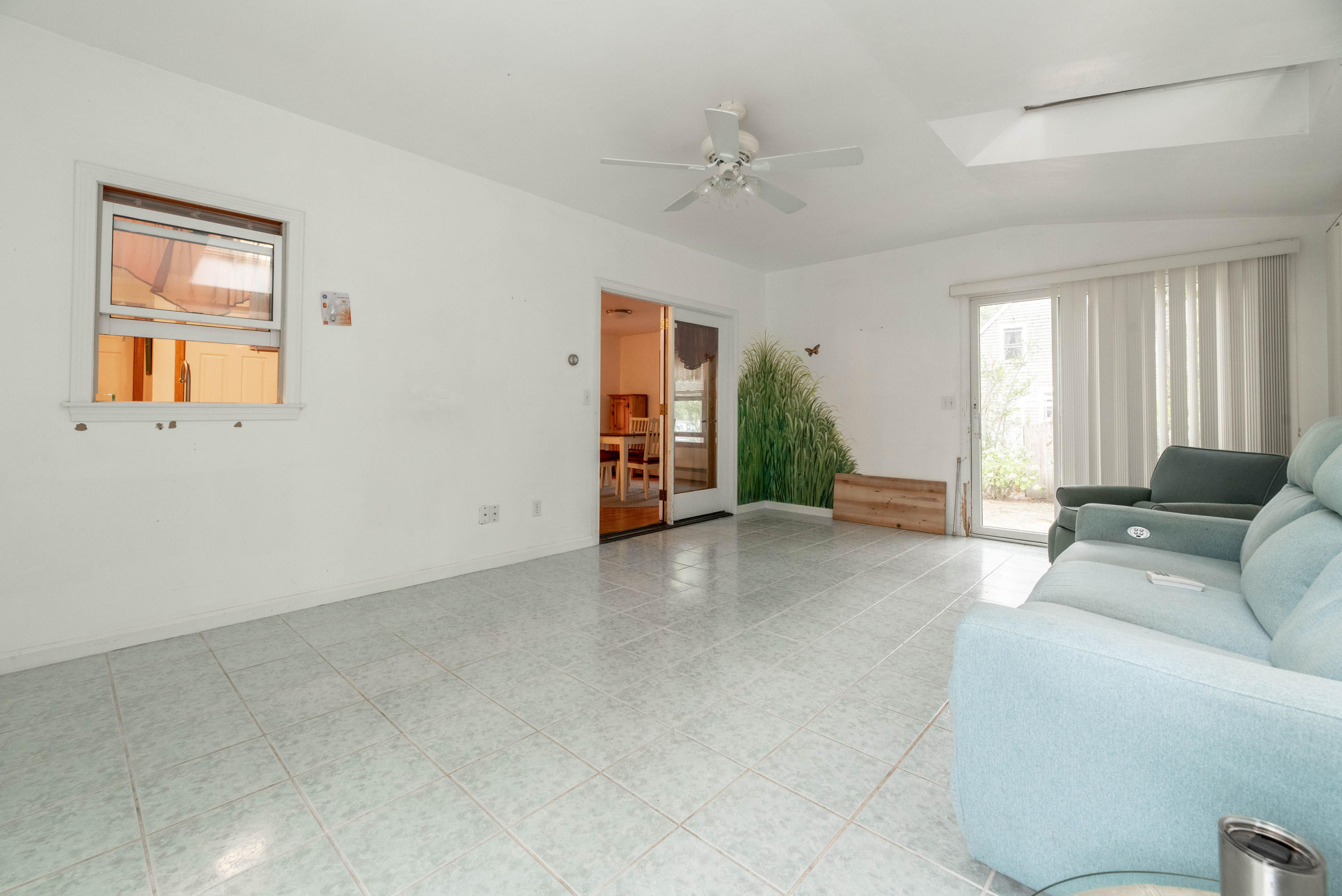187 James Circle Mashpee, MA 02649 - Photo 11 of 23 a living room with furniture and a large window