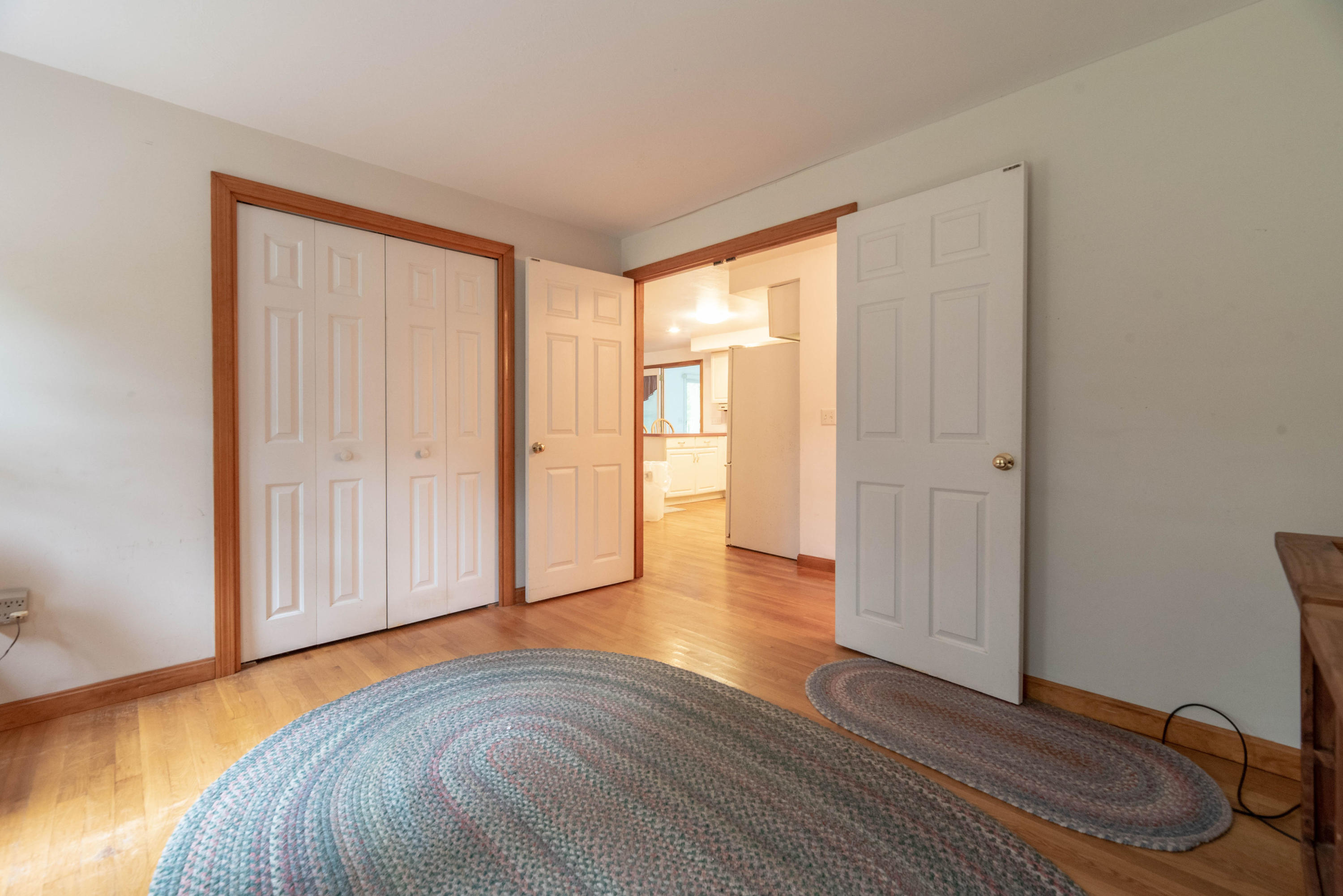 187 James Circle Mashpee, MA 02649 - Photo 13 of 23 a view of an empty room with wooden floor and a window