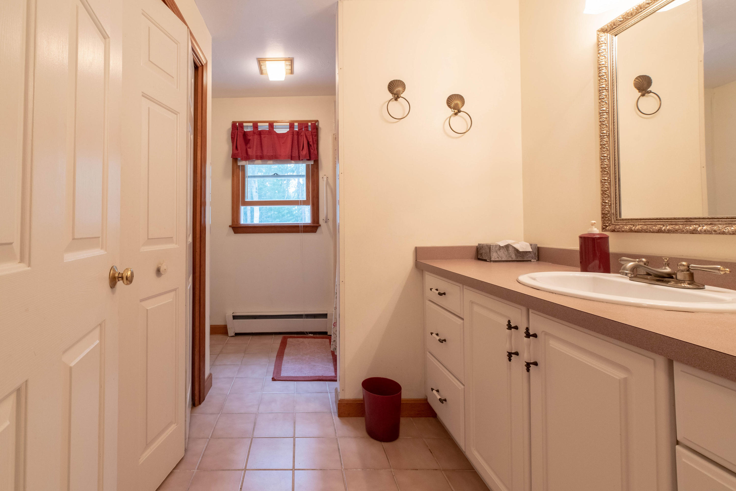 187 James Circle Mashpee, MA 02649 - Photo 14 of 23 a spacious bathroom with a double vanity sink a mirror and a shower