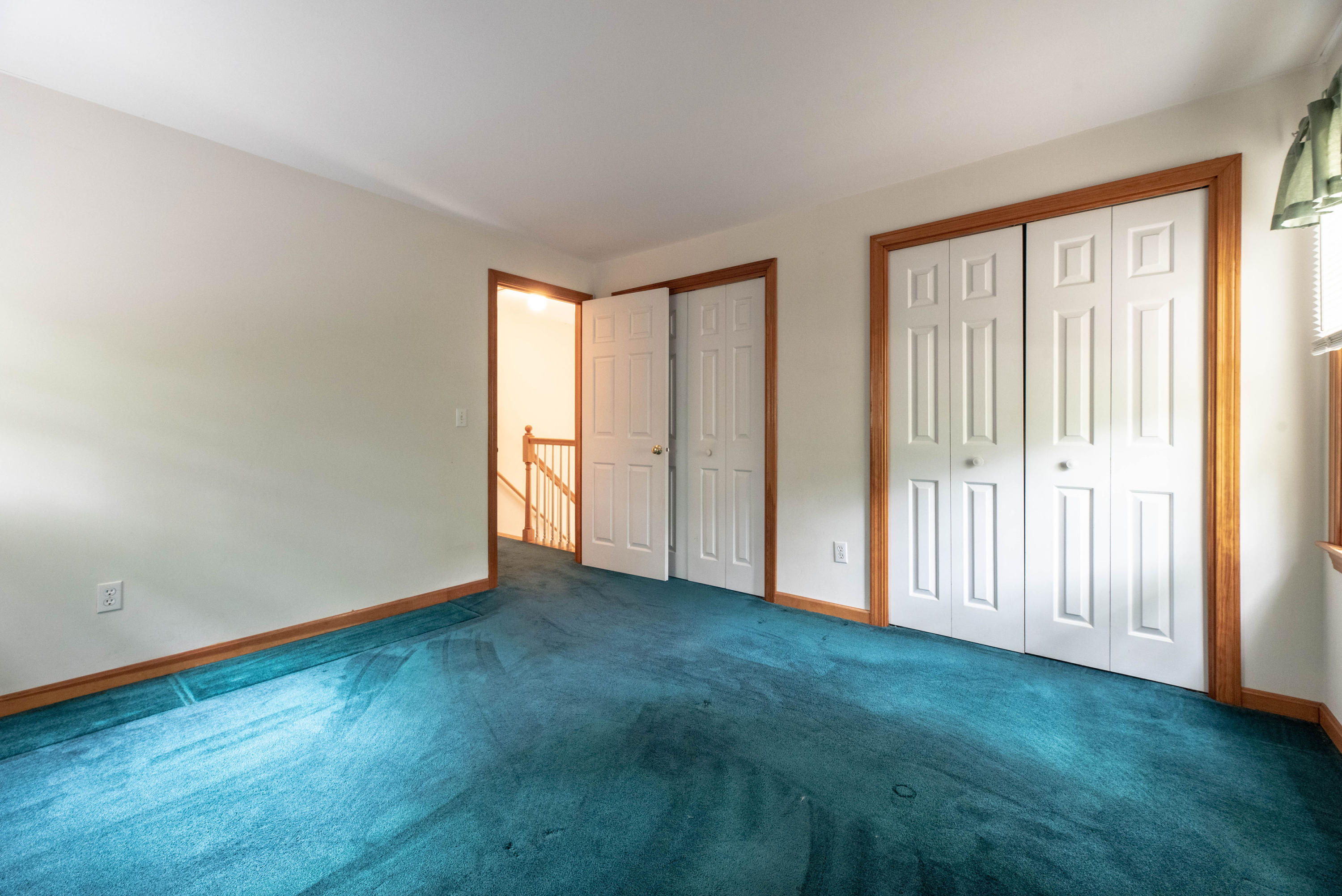 187 James Circle Mashpee, MA 02649 - Photo 18 of 23 a view of an empty room with closet and a window
