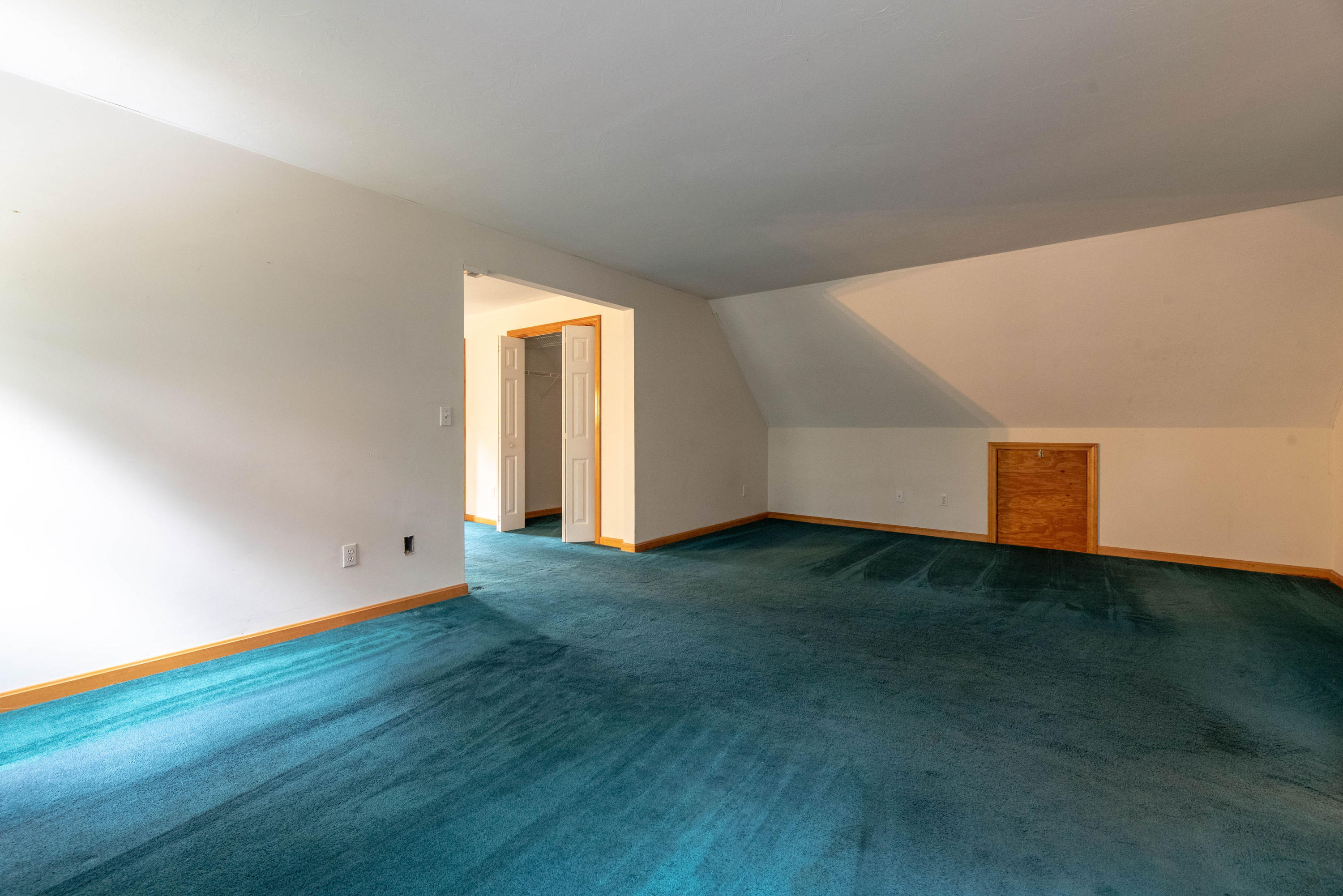 187 James Circle Mashpee, MA 02649 - Photo 19 of 23 a view of an empty room with wooden floor and windows