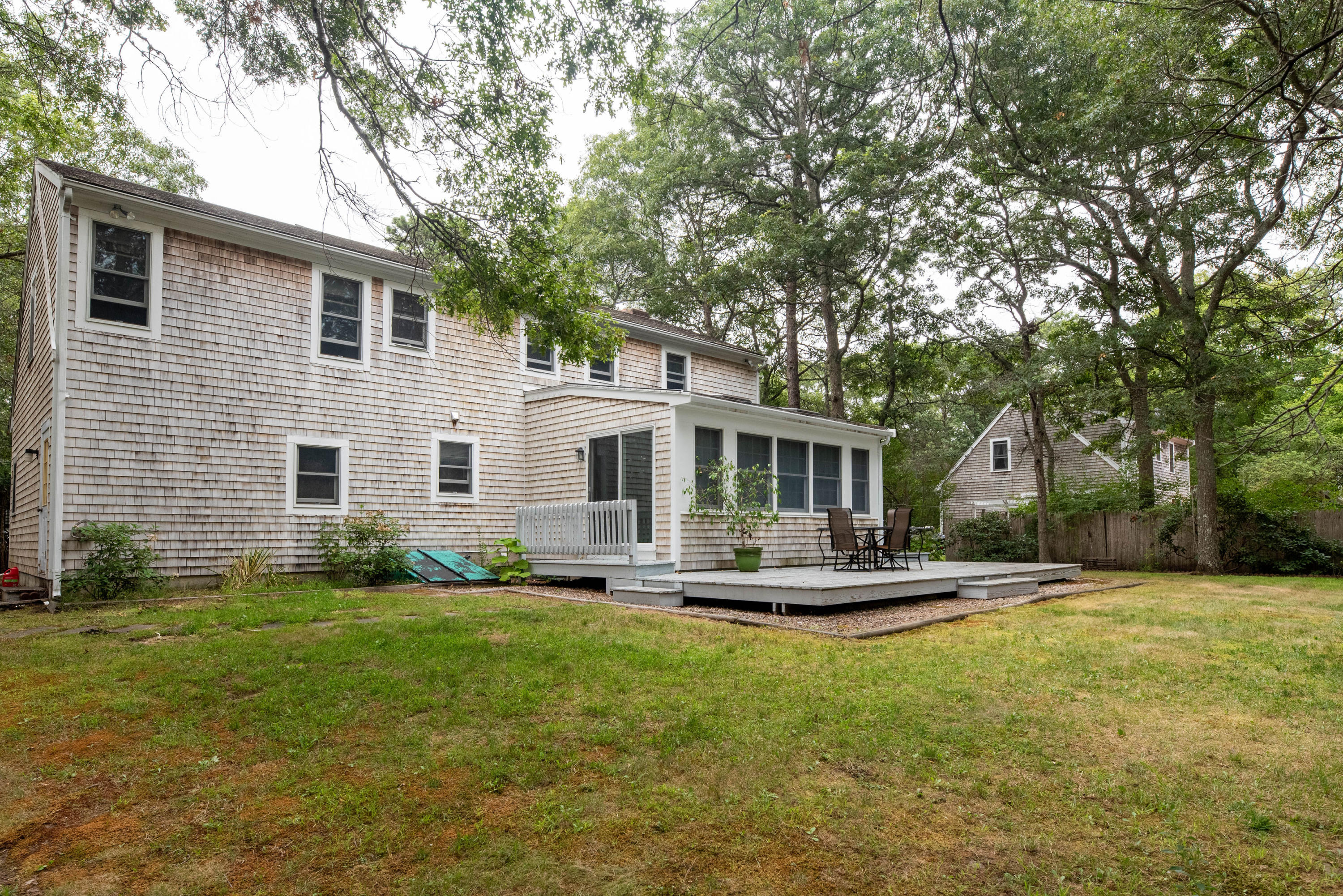 187 James Circle Mashpee, MA 02649 - Photo 2 of 23 a front view of house with yard and green space