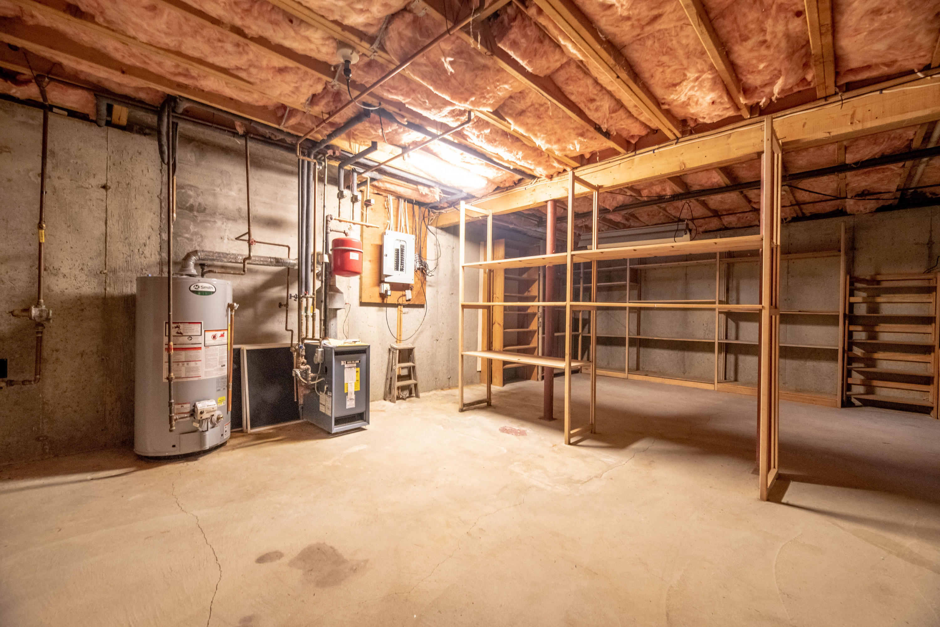 187 James Circle Mashpee, MA 02649 - Photo 23 of 23 a view of a room with wooden shelves