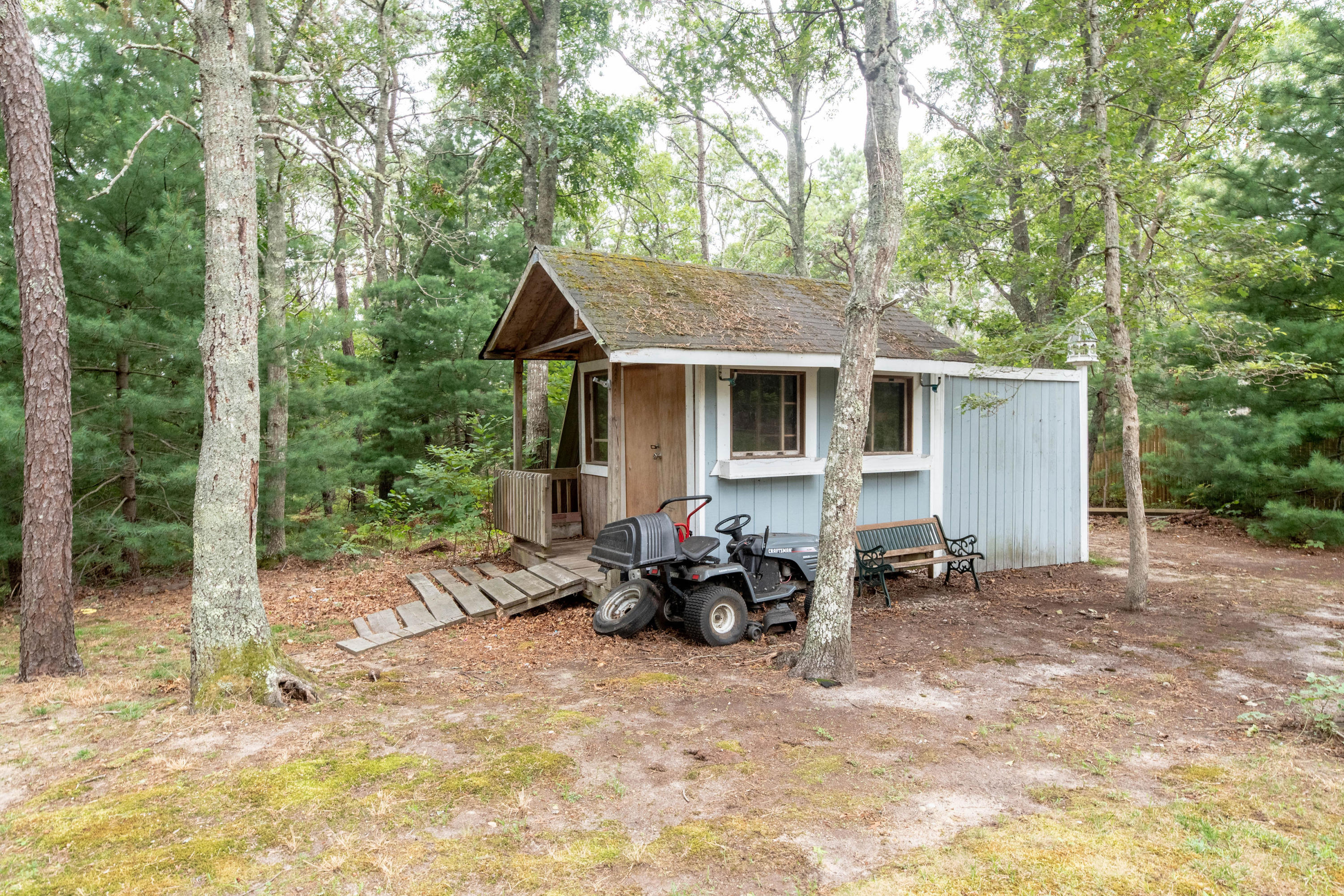 187 James Circle Mashpee, MA 02649 - Photo 3 of 23 a backyard of a house with table and chairs