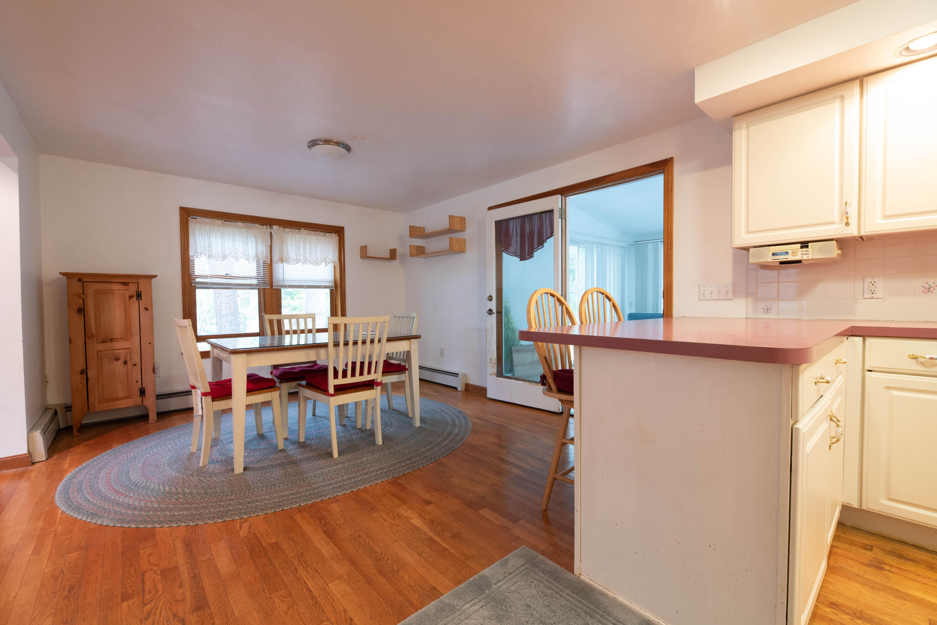 187 James Circle Mashpee, MA 02649 - Photo 9 of 23 a dining room with furniture and wooden floor