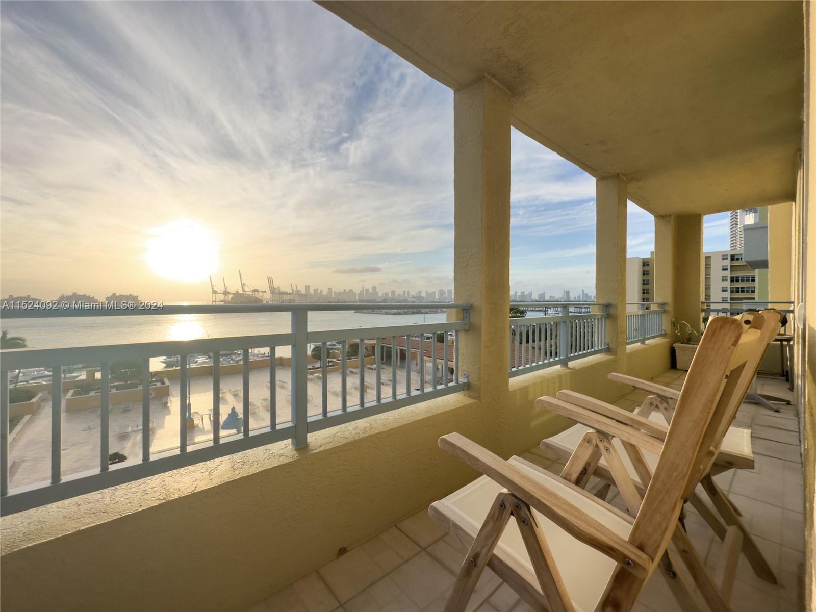 90 Alton Road, Unit 902 Miami Beach, FL 33139 - Photo 3 of 35 a view of balcony with furniture and city view