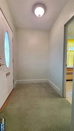 an empty room with mirror